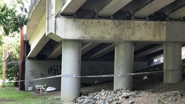 Under a bridge in Woolcock Park, where a fifth man was stabbed, but not seriously injured.