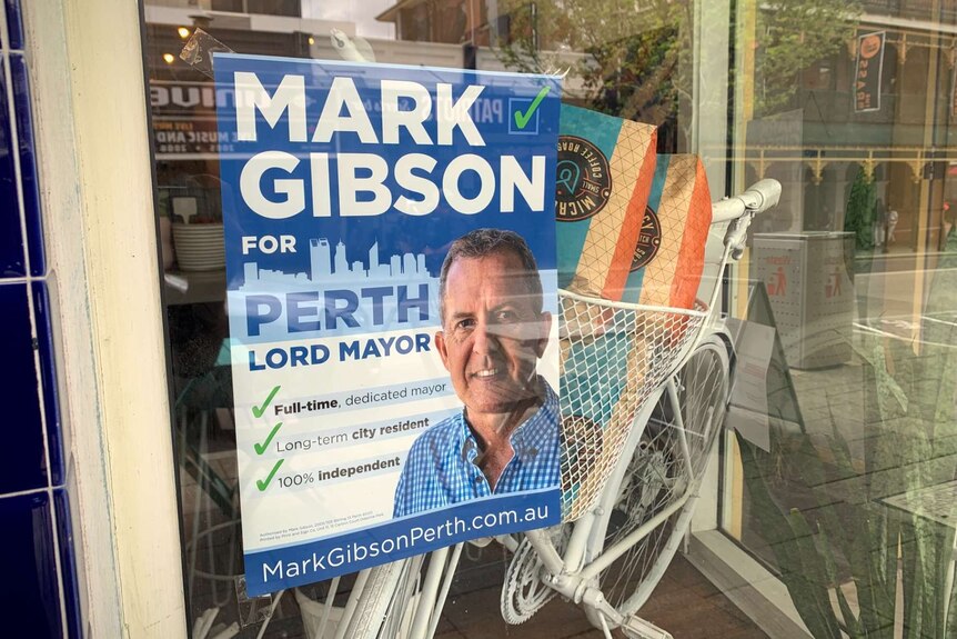 A campaign poster advocating for Mark Gibson to become Perth's next Lord Mayor on a cafe window in Northbridge.