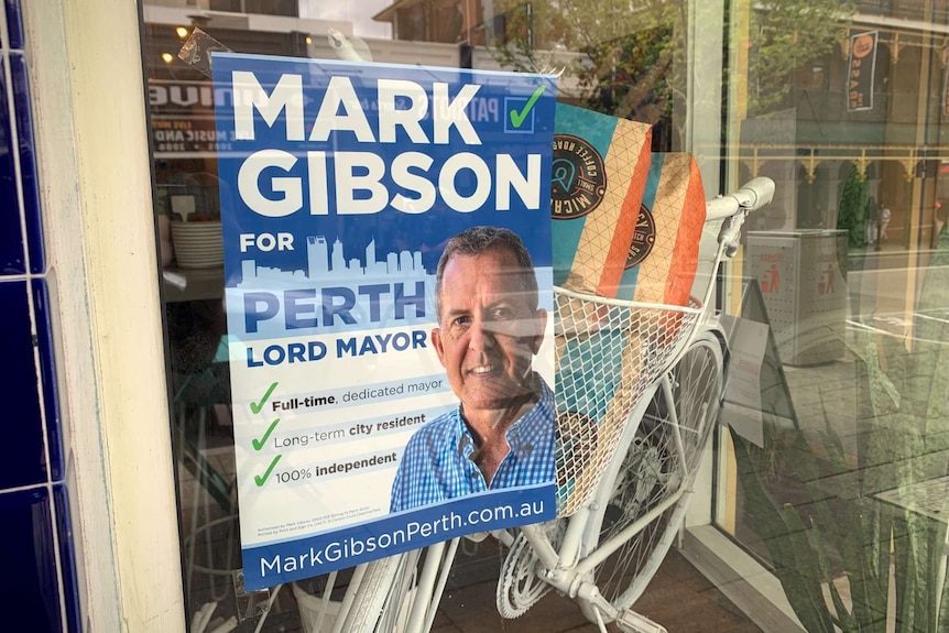 A campaign poster advocating for Mark Gibson to become Perth's next Lord Mayor on a cafe window in Northbridge.