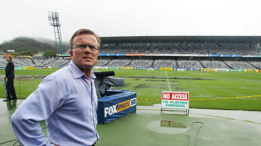 Wet weekend: Jets coach Branko Culina surveys the scene in Gosford.