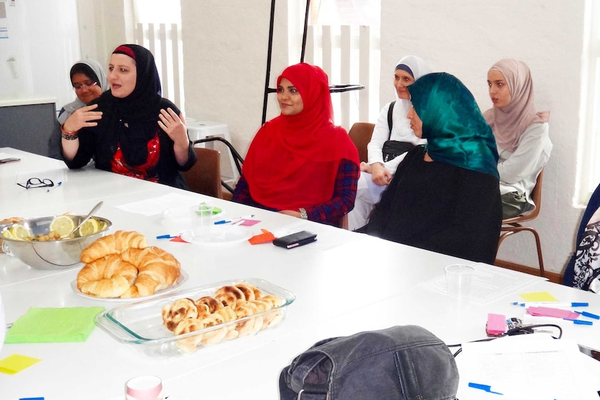 Muslim women talking together at Passion Cafe