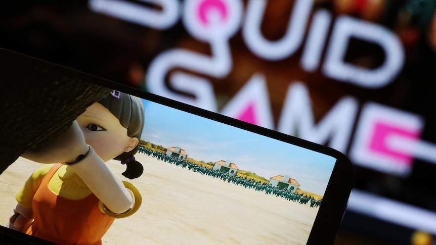 The Netflix series Squid Game is played on a mobile phone in this picture illustration