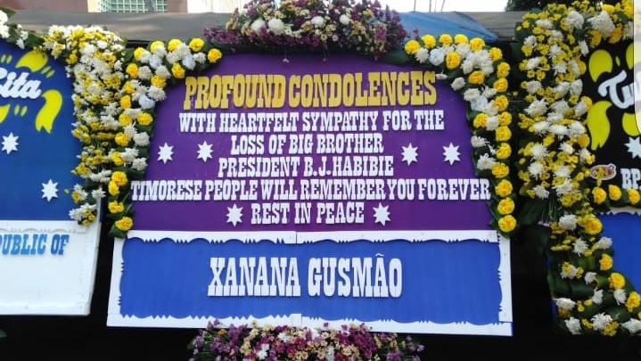 A large message that reads "profound condolences" bordered with flowers.