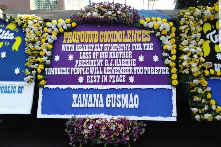 A large message that reads "profound condolences" bordered with flowers.