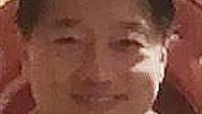 a headshot of Tse Chi Lop wearing a collared shirt and short black hair