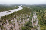 An aerial photo of a flooded river in bushland