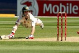 Simon Katich dives to avoid being run out