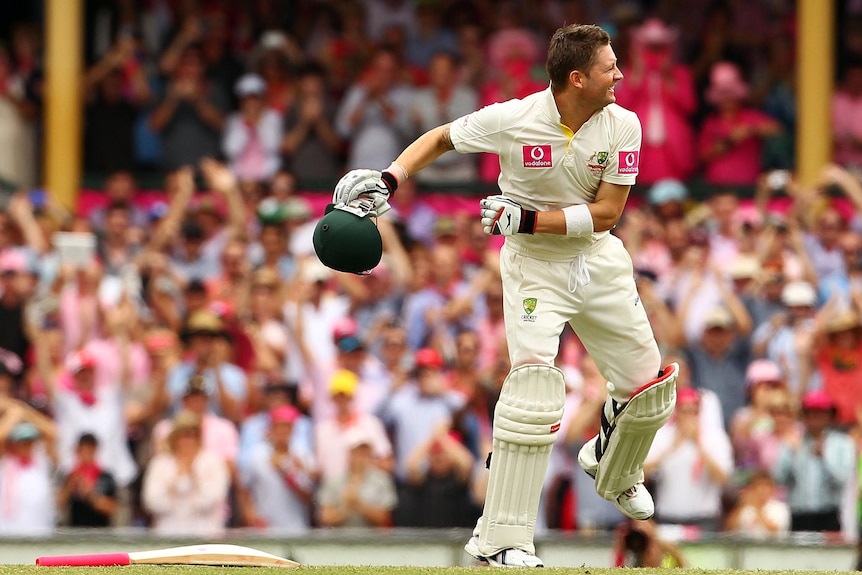Michael Clarke drops his bat and punches the air as he celebrates his triple century.