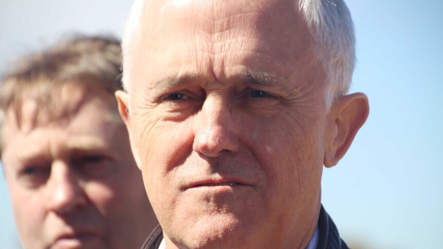 A tight head shot of Prime Minister Malcolm Turnbull outdoors.