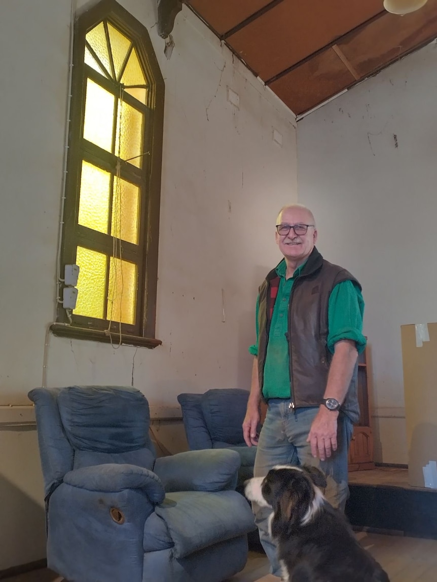 A man standing in a church smiling