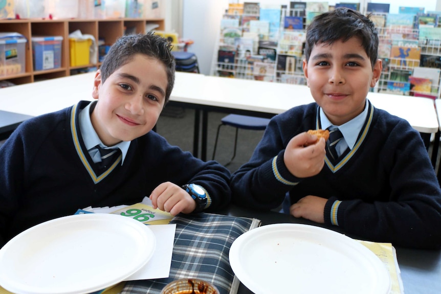 Two students at Holy Saviour School during a cultural integration class.