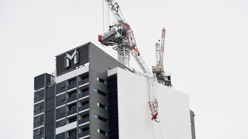Three men were taken to hospital after a crane collapsed in North Sydney.