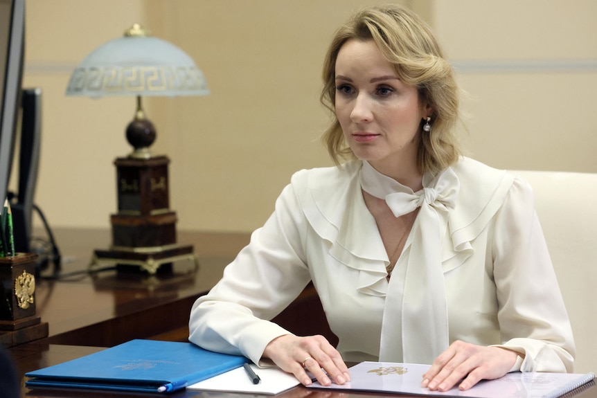 Russian Presidential Commissioner for Children's Rights Maria Lvova-Belova  sitting in an office