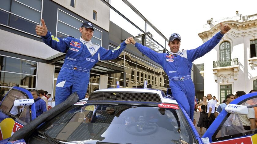South African driver Giniel De Villiers (R) and German co-driver Dirk Von Zitzewits celebrate