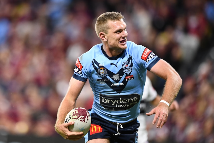NSW Blues Tom Trbojevic stands up after scoring a State of Origin try.