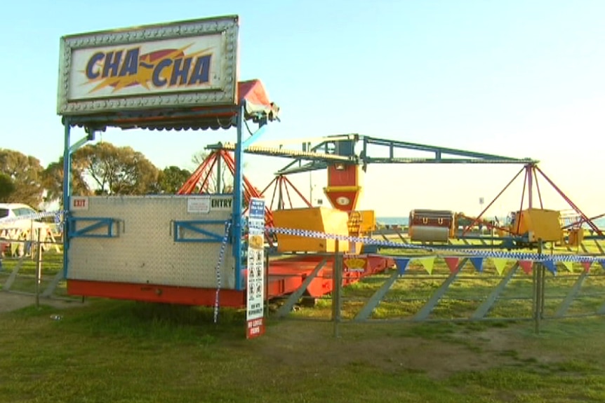 The ticket booth sits in front of the Cha Cha ride on parkland near the beach at Rye