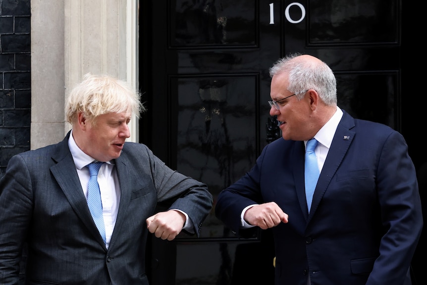 Boris Johnson and Scott Morrison bump elbows outside No 10.