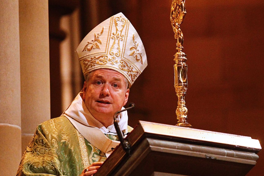 Archbishop Anthony Fisher speaks at a lectern