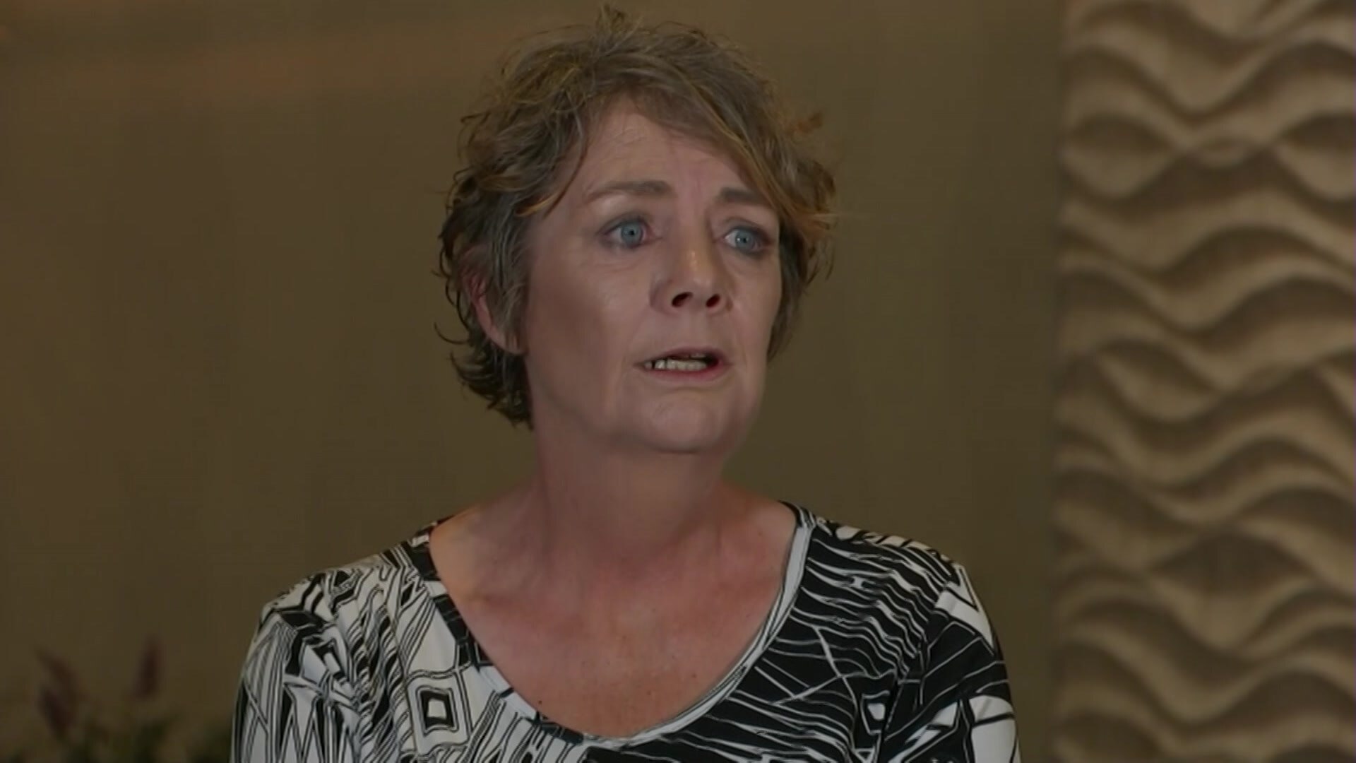 TV still shot of Kath speaking.