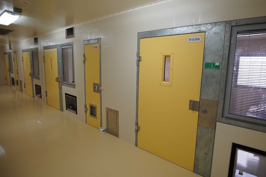 A detention unit with yellow doors