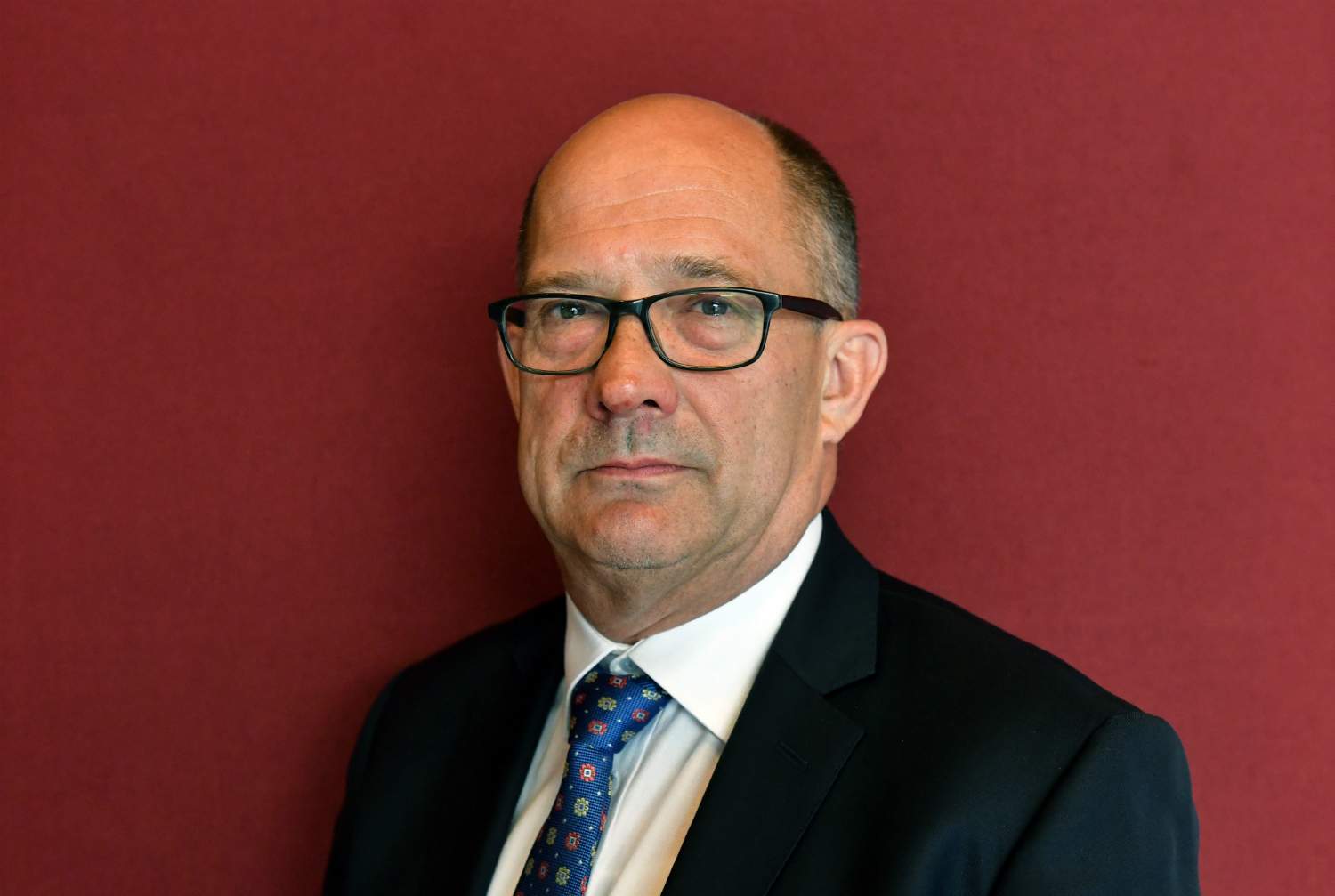 A man looks at the camera.