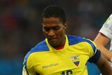 Ecuador's Anotnio Valencia tackles France's Lucas Digne