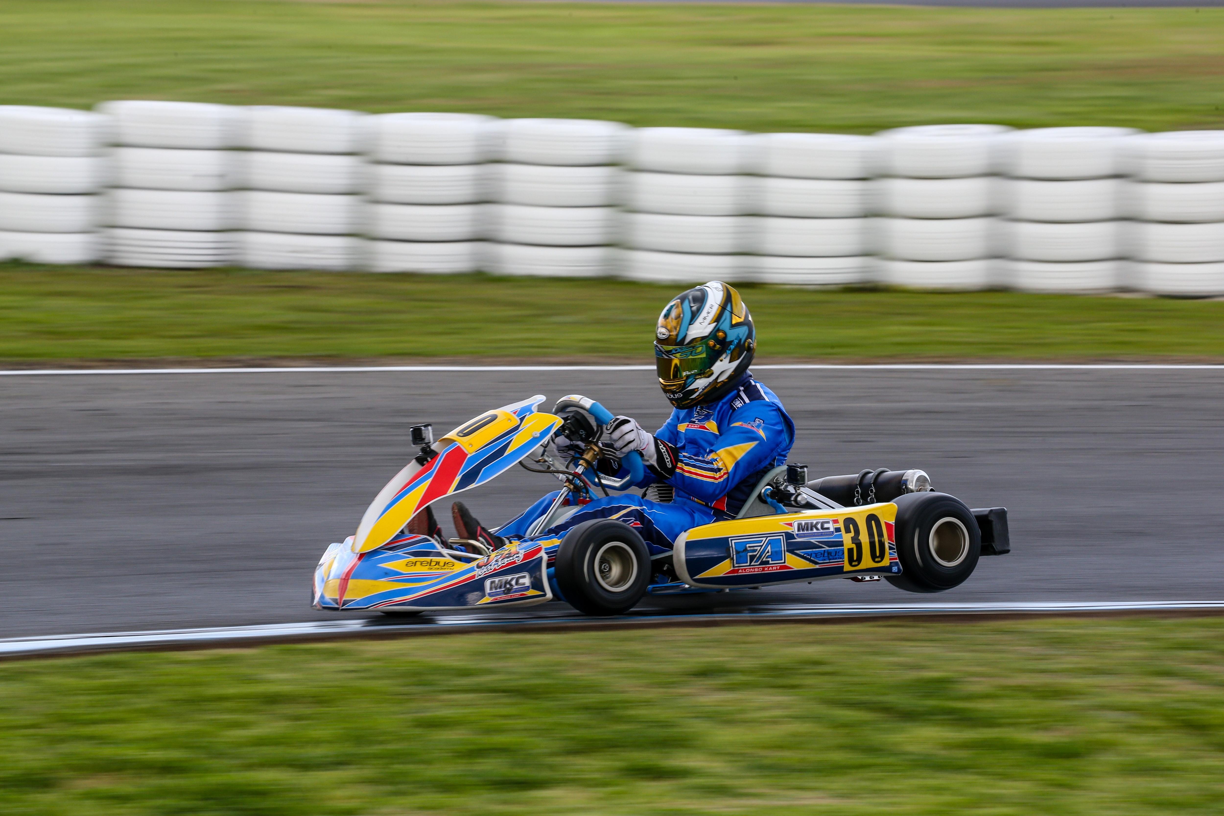 Person riding a go-kart on track