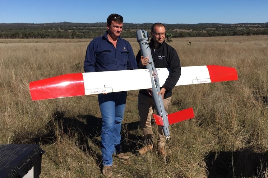 Craig Magnussen and Marcus Ehrlich with a $500,000 military-grade drone