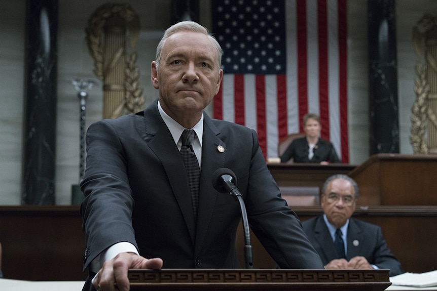 Frank Underwood stands at a podium in House of Cards