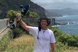 Tom Drury pictures along the Sea Cliff Bridge in Wollongong, NSW on his 3,600 kilometre trip from Melbourne to Cairns.