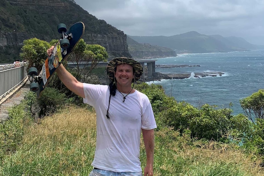 Tom Drury pictures along the Sea Cliff Bridge in Wollongong, NSW on his 3,600 kilometre trip from Melbourne to Cairns.