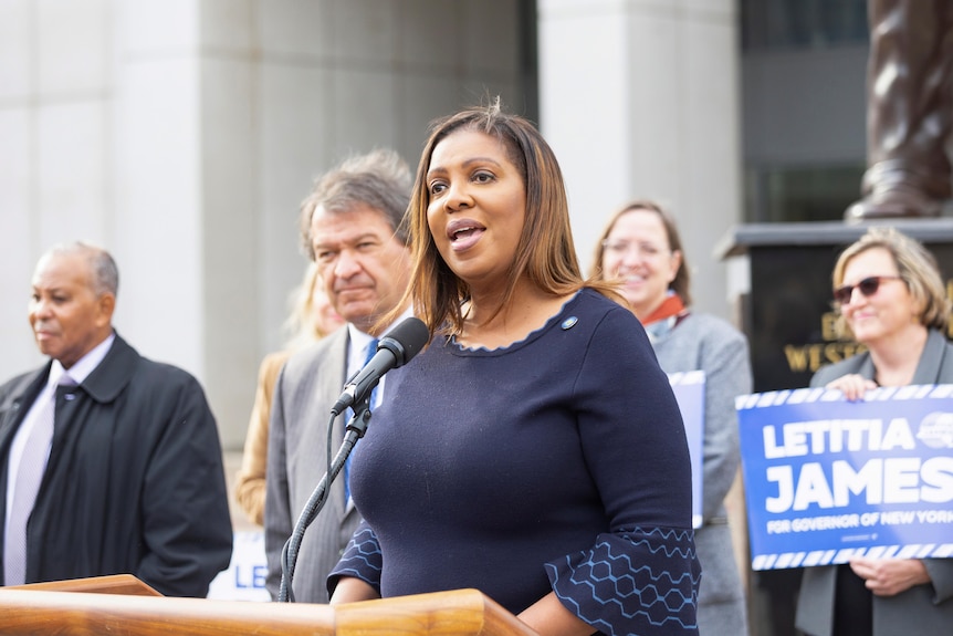 New York State Attorney General Letitia James speaks at a podium at an event in New York, December 2, 2021.