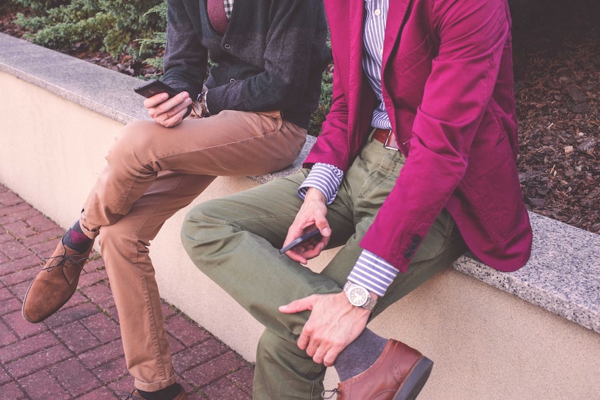 Two men wearing smart casual work wear and shoes to depict a office appropriate wardrobe for men.