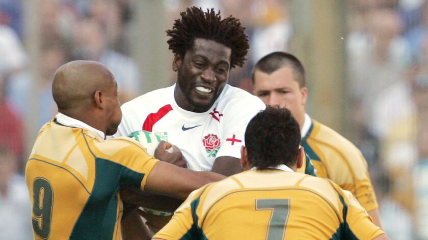 England winger Paul Sackey vies with George Gregan and George Smith