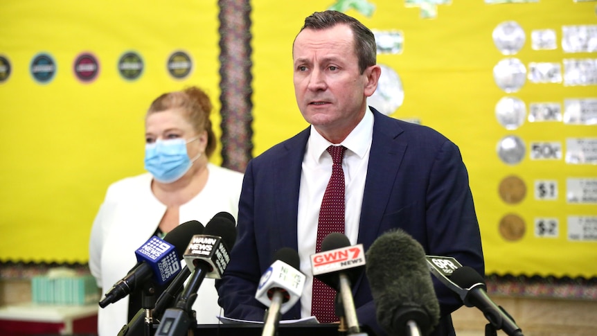WA Premier Mark McGowan at a media conference in front of Education Minister Sue Ellery.