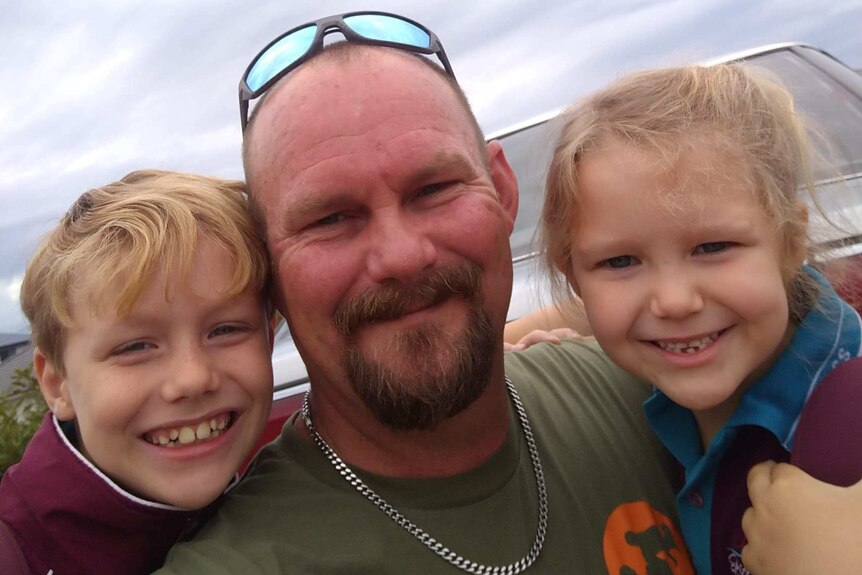 Deon Krahe, 40, with his two children Elias, 8 and Ariana, 6 on the Sunshine Coast in Queensland.