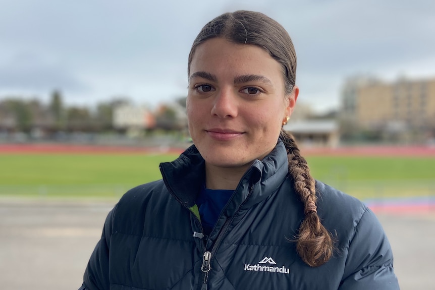 A woman in a puffer jacket.