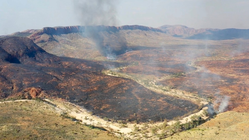 a fire burning in a range in Central Australia.