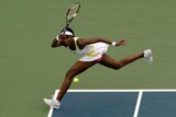 Venus Williams hits a return against Alona Bondarenko
