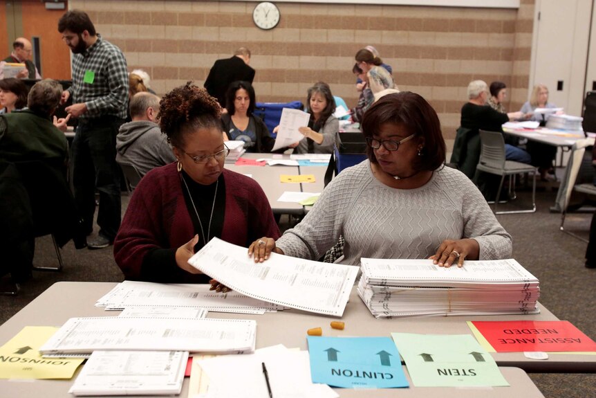 Officials count election ballots at the 2016 US election.