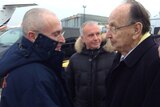 Mikhail Khodorkovsky shakes hands with Hans-Dietrich Genscher upon arrival at Schoenefeld airport in Berlin.