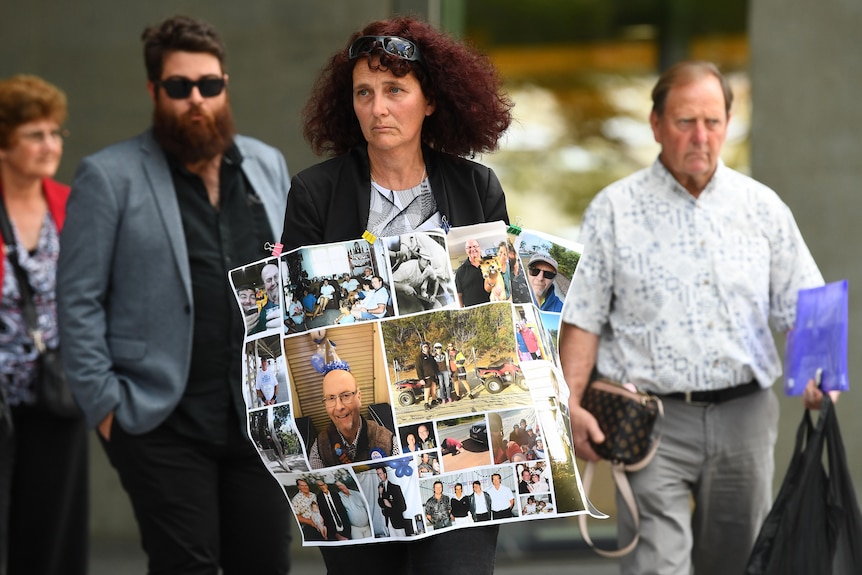 Family of Ian Seibel leave court holding a poster with Ian's photograph