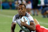 Fiji's Osea Kolinisau scores a try