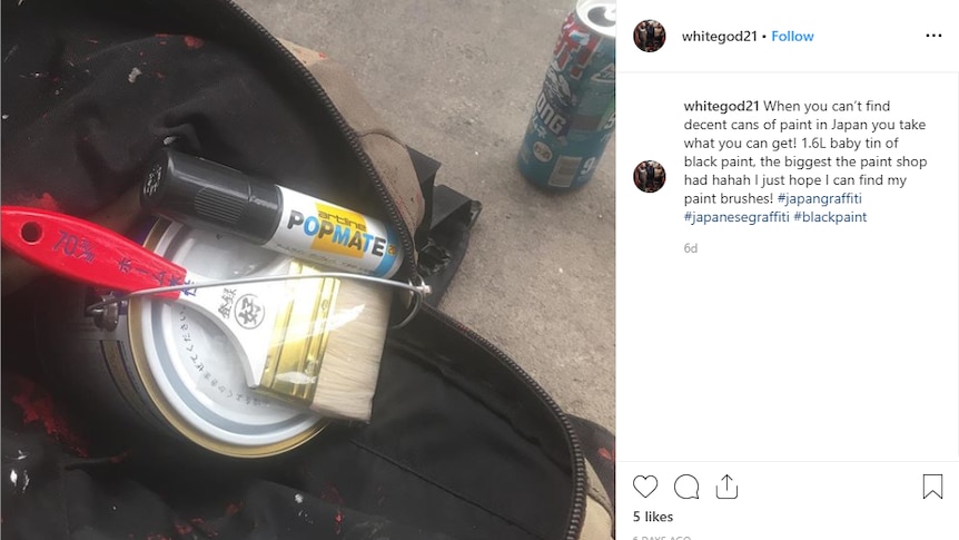 A screenshot of an Instagram post of paintbrushes and paint cans