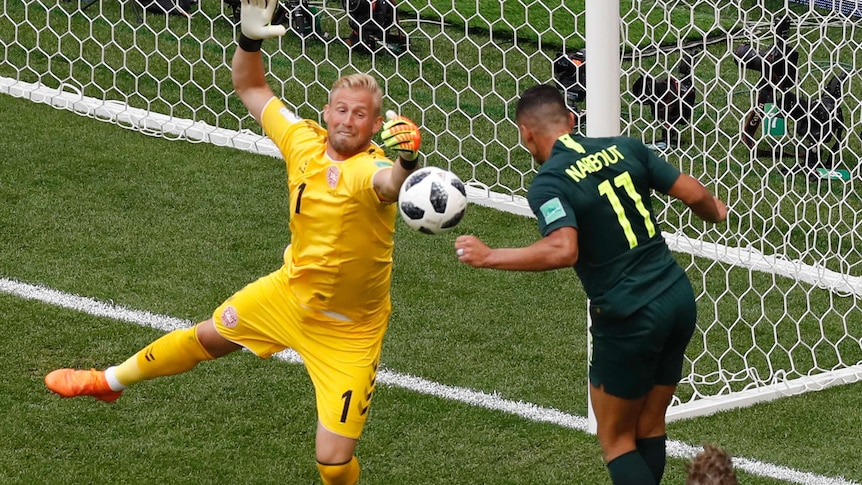 Andrew Nabbout is denied by Kasper Schmeichel