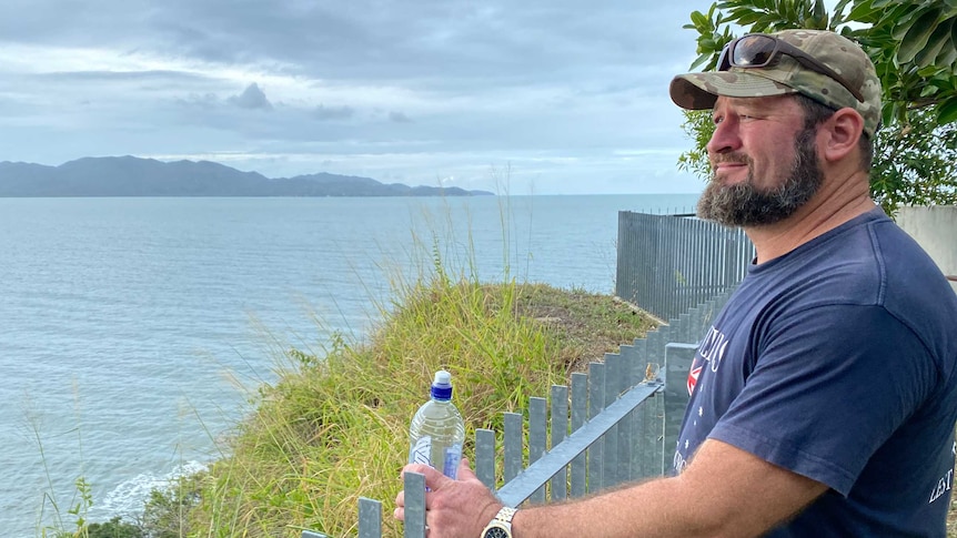 Wayne Karakyriacos looks out over a fence.