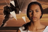 A harbour explosion behind actress Haylee Wright, surrounded by flying paper aeroplanes