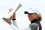 Sophia Popov lifts the Women's British Open trophy.