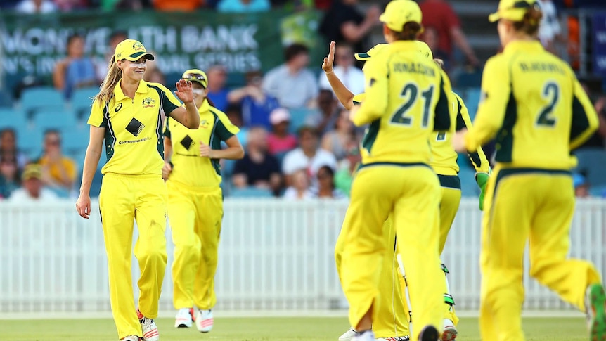 Ellyse Perry is congratulated by Southern Stars team-mates