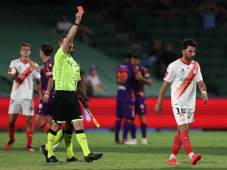 Tolgay Arslan is shown a red card